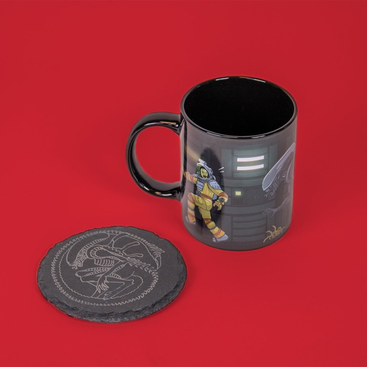 a matching coaster set inspired by alien with a 11oz mug and black slate engraved coaster of a xenomorph