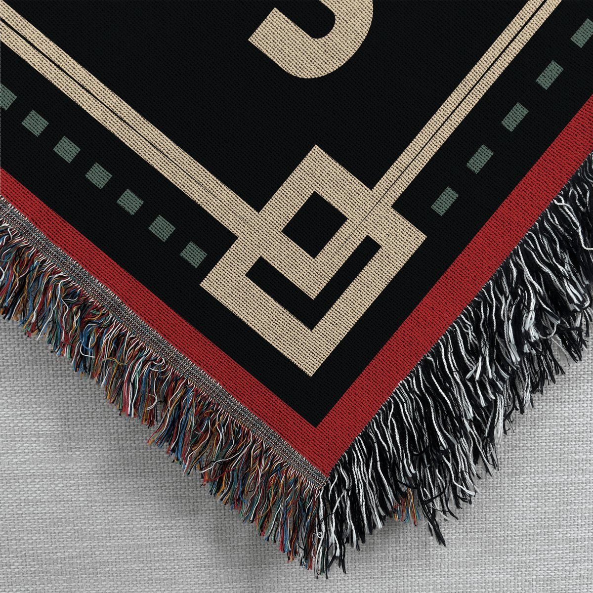 a woven tapestry style blanket with a merry krampus design printed on it