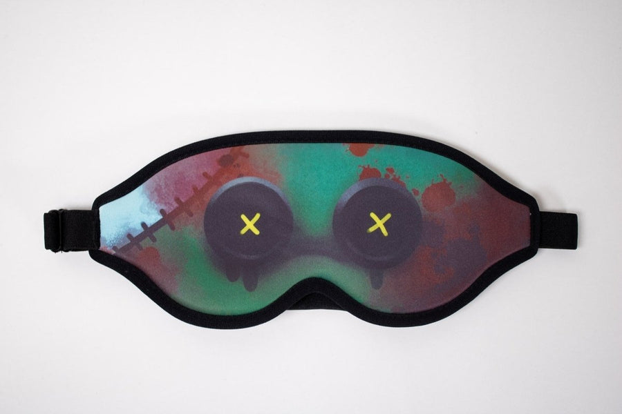 Colorful sleep mask with abstract bloody buttoneyes design on a white background