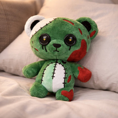 Green plush toy with red accents on a beige surface