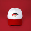 a white and red hat embroidered with a machete and "I survived crystal lake" on the front