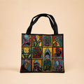 Tote bag with colorful graphic horror designs on a beige background