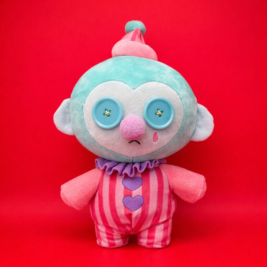 creepy Colorful stuffed animal monkey with a red background