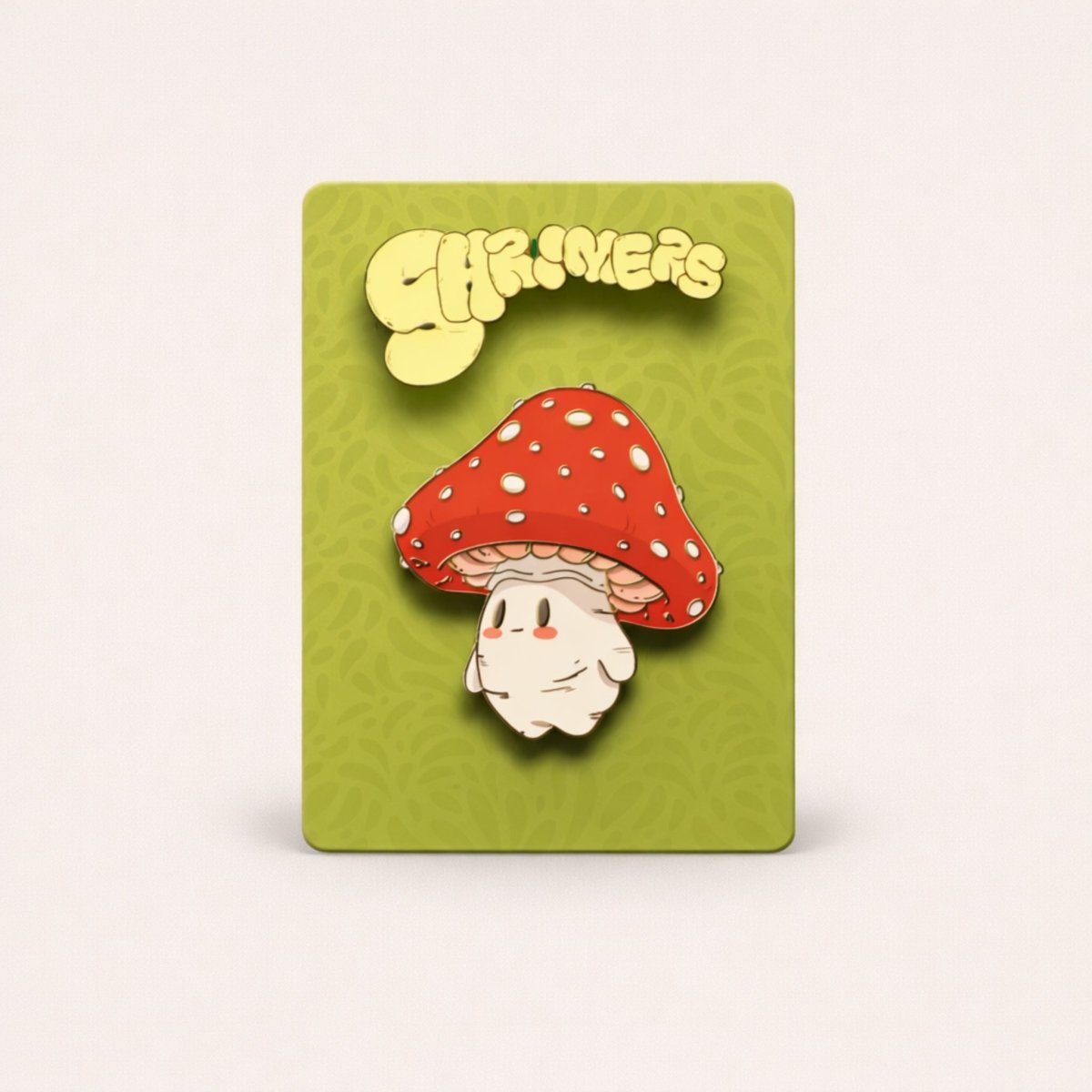 Pin with a mushroom design on a green card with 'Shroomers' branding.