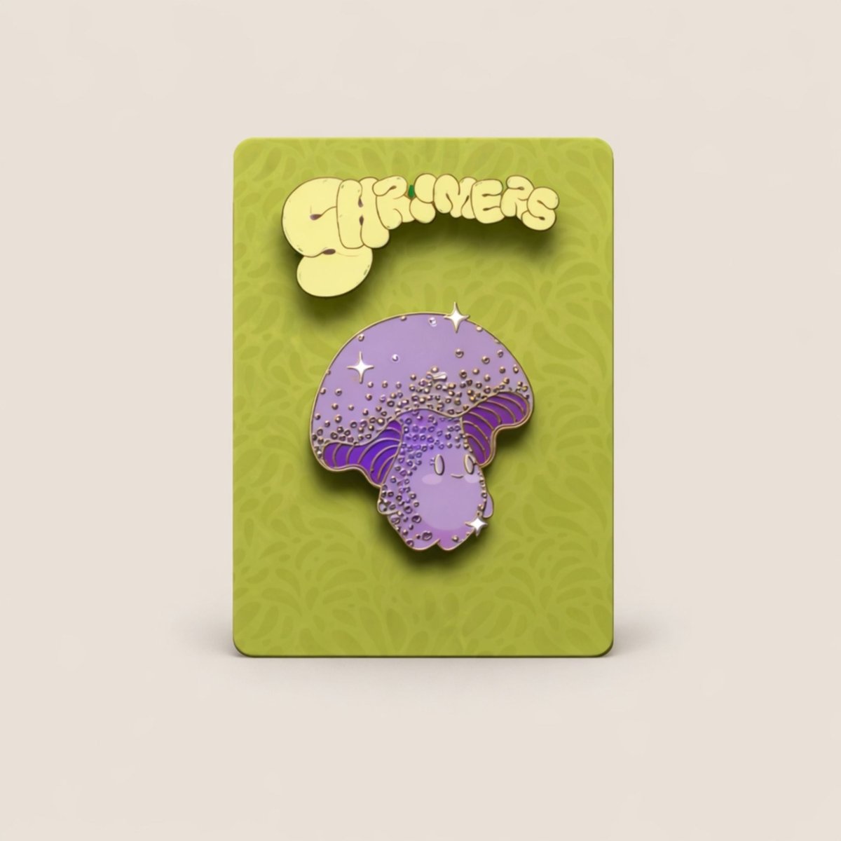 Purple mushroom-shaped enamel pin on a green card with 'Shroomers' branding.