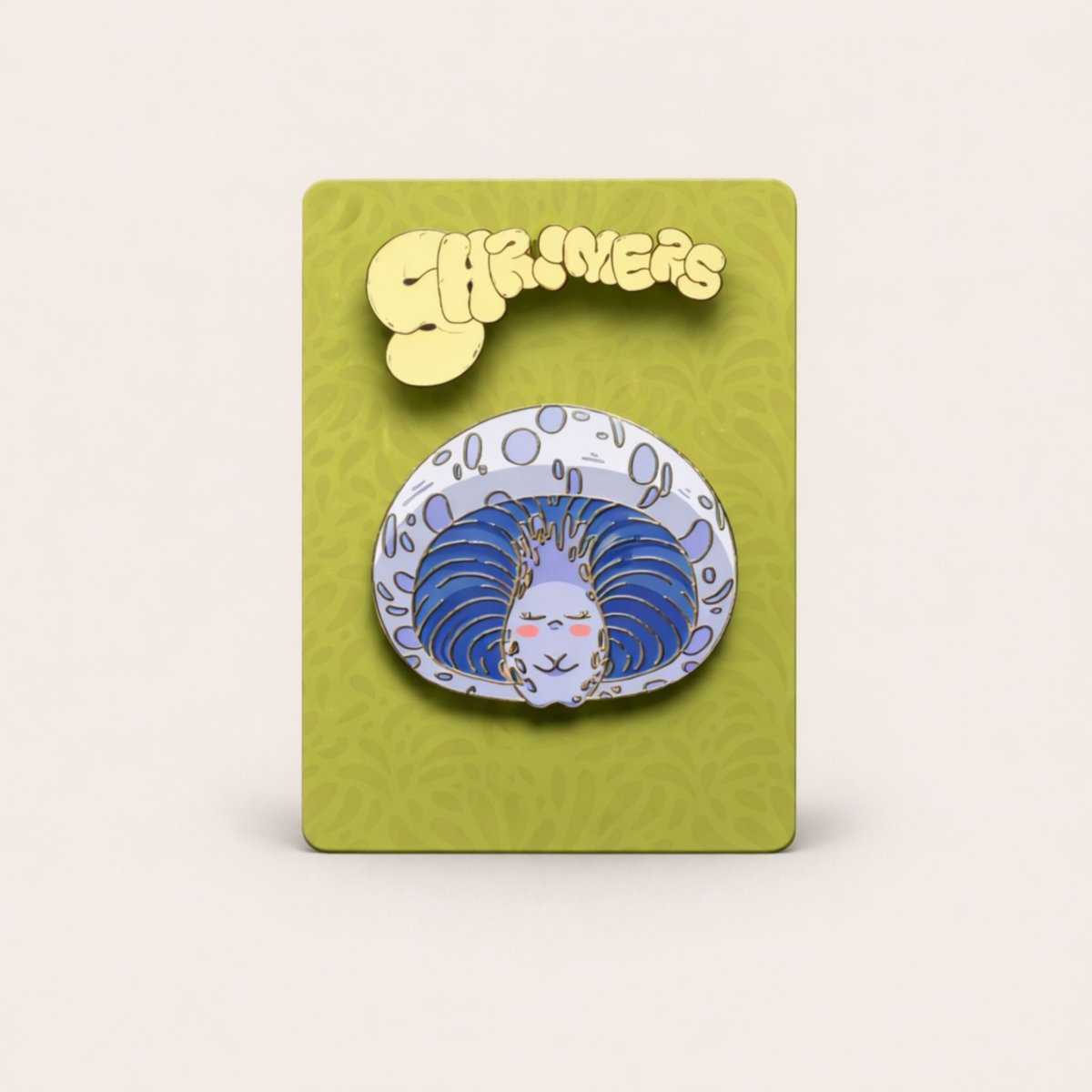 Pin with a blue and white design on a green card with 'Shroomers' branding.