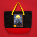 a large black bag with a red bottom and yellow handles, featuring a swim risk design printed on it