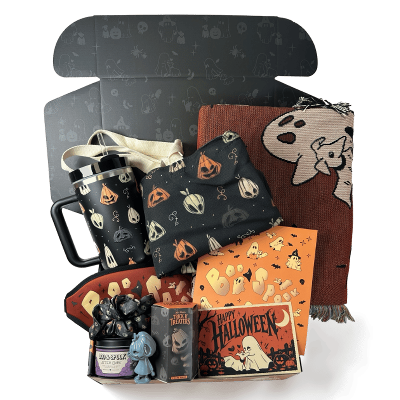 All nine items in the Sterye Boo Box: woven blanket, 40oz tumbler, tote, candle, sleeping mask, collectible figure, sticker sheet, scrunchie and postcard.