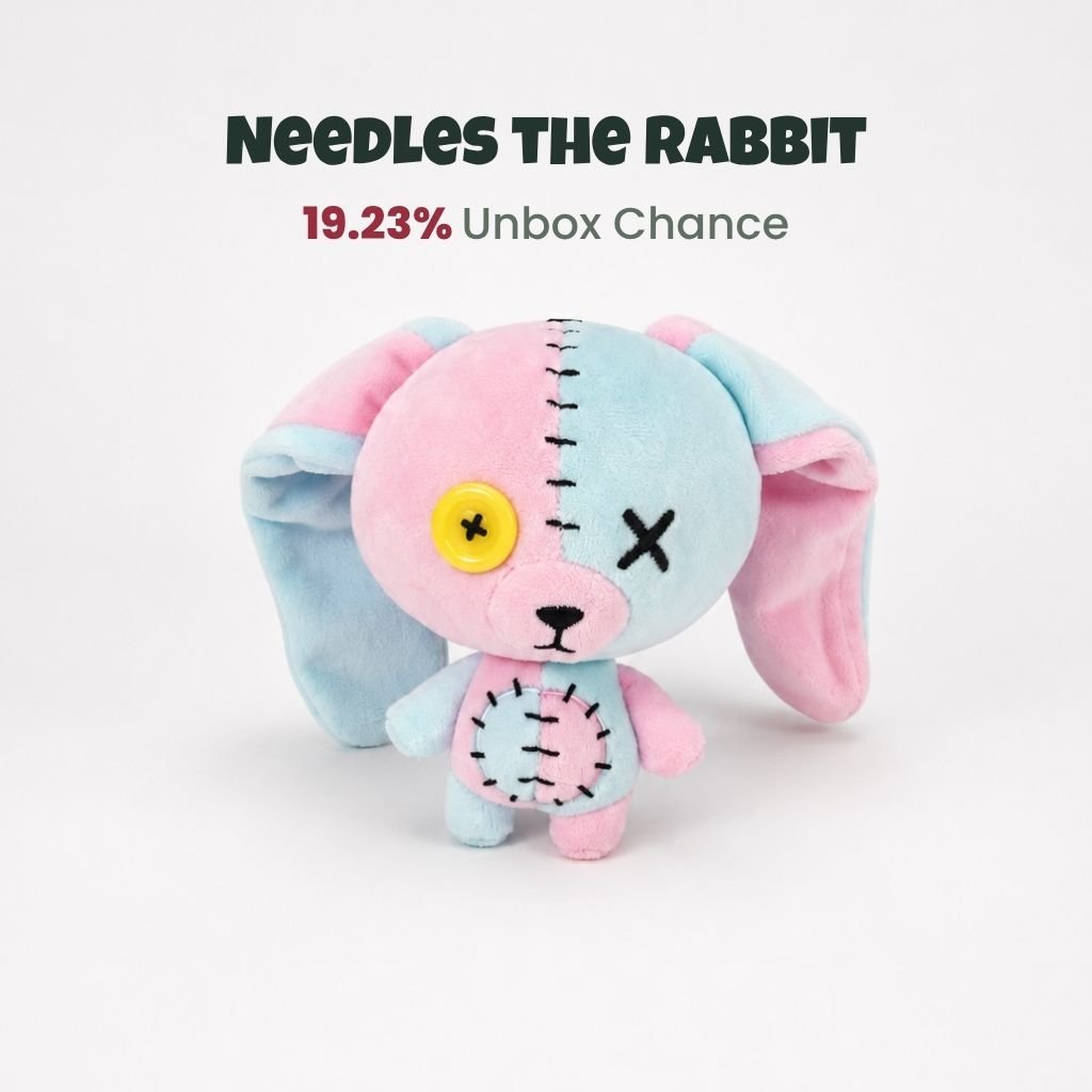 Needles the Rabbit ButtonEyes plushie with pastel pink and blue patchwork design and yellow button eye