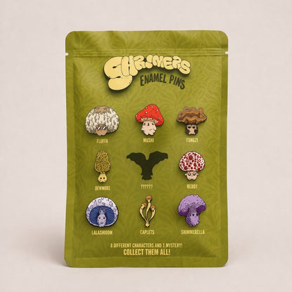 Packaged set of mushroom-themed enamel pins with 'Shroomers' branding on a beige background.