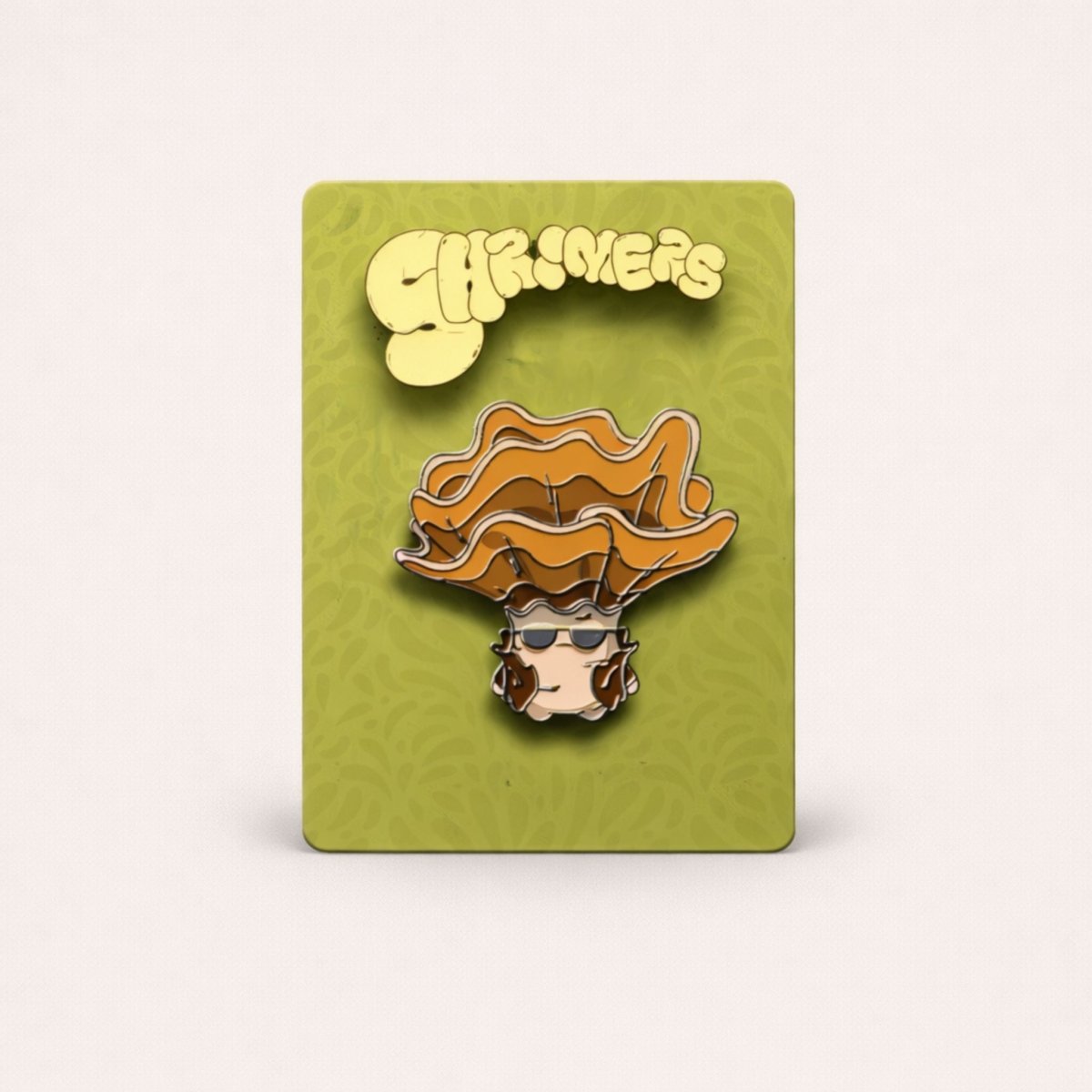 Pin with a character wearing a hat on a green card with 'Shroomers' text