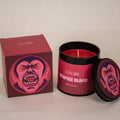 Vampire-themed candle with packaging on a neutral background